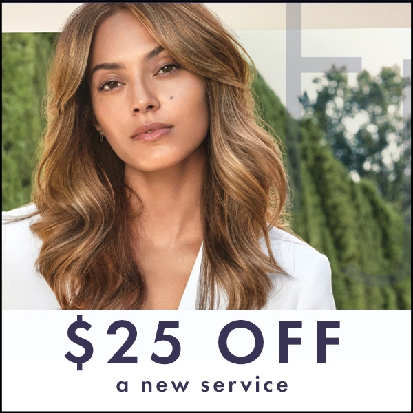 Woman with beautiful, wavy hair posing with hand on face, advertising a $20 gift toward a new salon service. - Tonya Jones SalonSpa| Birmingham, AL