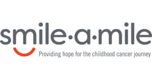 The Smile-A-Mile logo with a red curved line as a smile and the tagline "Providing hope for the childhood cancer journey. - Tonya Jones SalonSpa| Birmingham, AL
